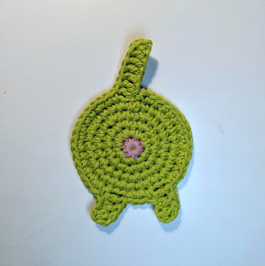 A green cat butt coaster