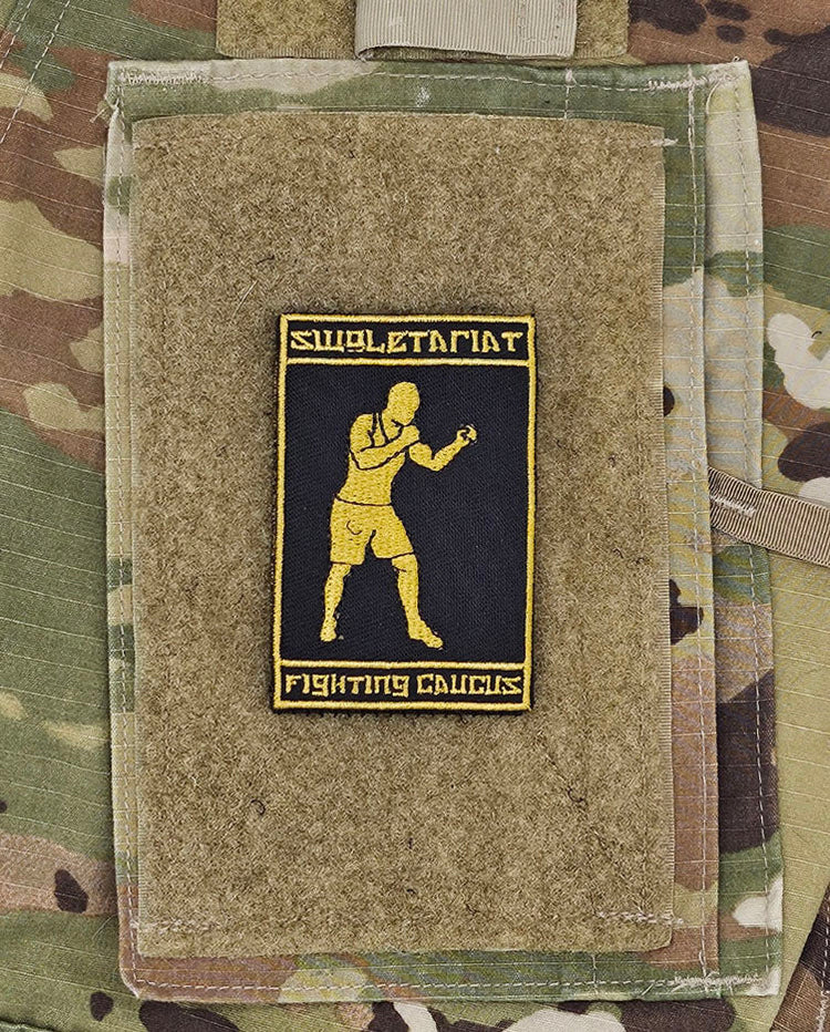 Patch with a boxing illustration on a camouflage background. Above says Swoletariat and below says Fighting Caucus