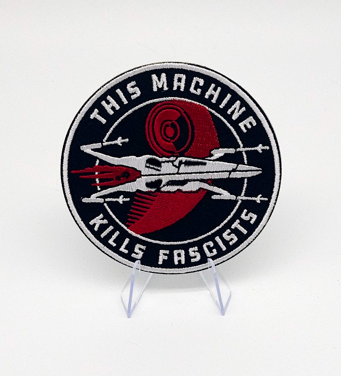 This Machine Embroidered patch (Adhesive backed)