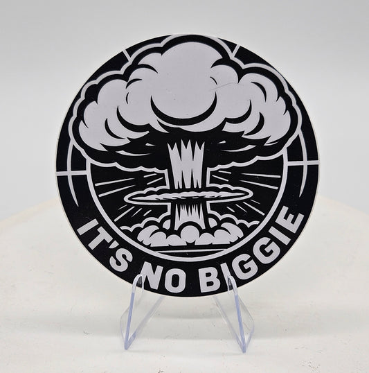a three inch vinyl sticker with nuclear explosion design and 'It's No Biggie' text on a stand.