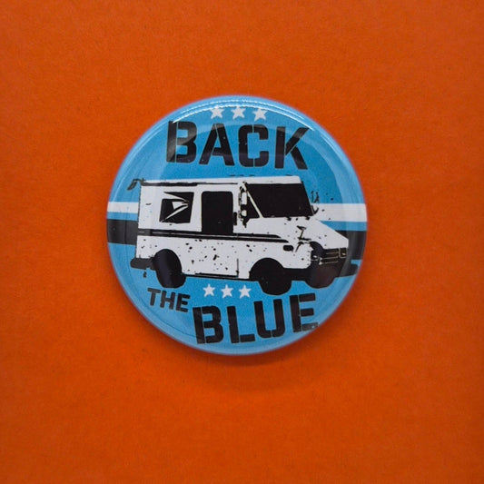 lapel button with a mail truck and Back The Blue on it on a blue background