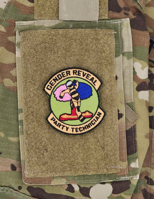 A guy in a bomb suit running away from a mushroom cloud that is half pink and half blue. It reads Gender Reveal Party Technician