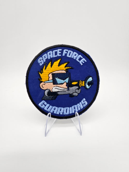 Embroidered patch with 'Space Force Guardians' design on a stand against a white background. Features Spaceman Spiff