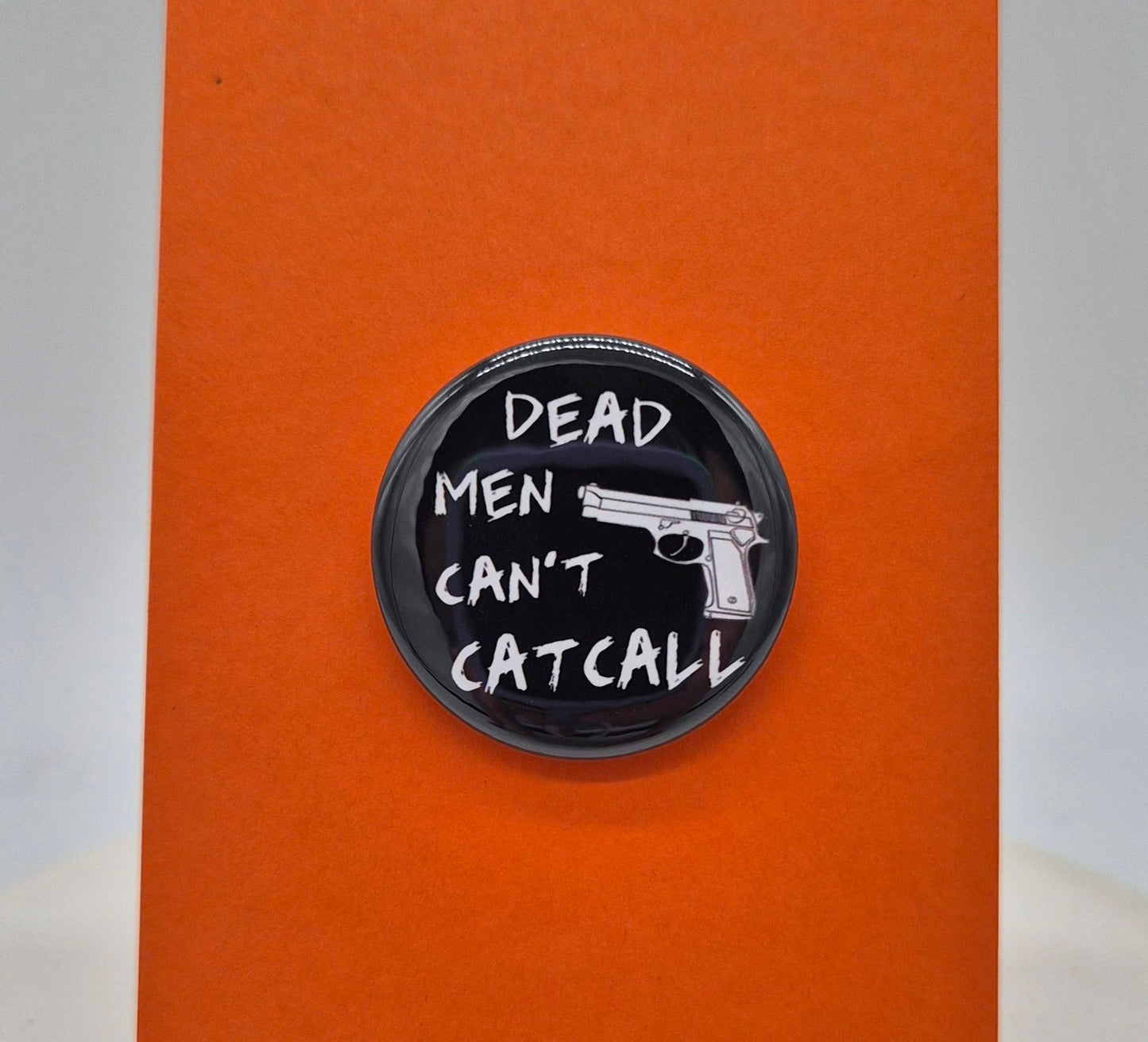 Dead men can't cat call Button